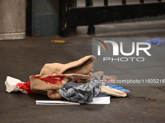 Bloody clothes and crime scene tape are at the scene. A man is stabbed at the East 138th Street and Grand Concourse MTA subway train station...