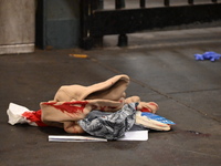 Bloody clothes and crime scene tape are at the scene. A man is stabbed at the East 138th Street and Grand Concourse MTA subway train station...