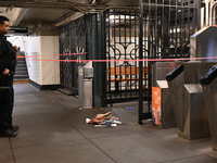 Bloody clothes and crime scene tape are at the scene. A man is stabbed at the East 138th Street and Grand Concourse MTA subway train station...