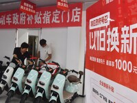 Consumers buy an electric bicycle at an electric bicycle trade-in promotion event in Yongnian district of Handan, China, on September 24, 20...