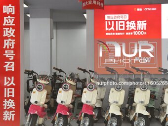 Consumers buy an electric bicycle at an electric bicycle trade-in promotion event in Yongnian district of Handan, China, on September 24, 20...