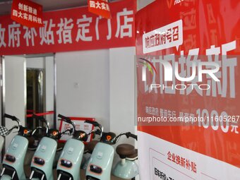 Consumers buy an electric bicycle at an electric bicycle trade-in promotion event in Yongnian district of Handan, China, on September 24, 20...