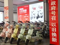 Consumers buy an electric bicycle at an electric bicycle trade-in promotion event in Yongnian district of Handan, China, on September 24, 20...