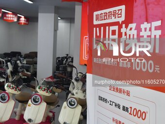 Consumers buy an electric bicycle at an electric bicycle trade-in promotion event in Yongnian district of Handan, China, on September 24, 20...