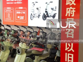 Consumers buy an electric bicycle at an electric bicycle trade-in promotion event in Yongnian district of Handan, China, on September 24, 20...