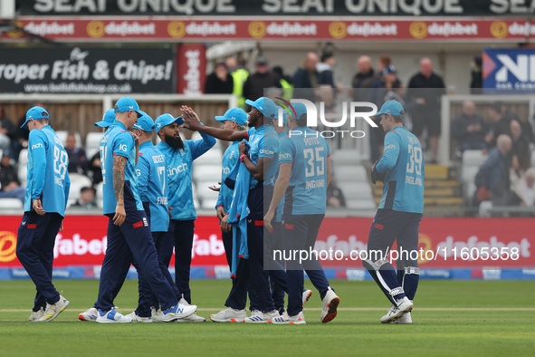 England's Jofra Archer celebrates with Adil Rashid after he dismisses Australia's Matthew Short during the Metro Bank One Day Series match b...