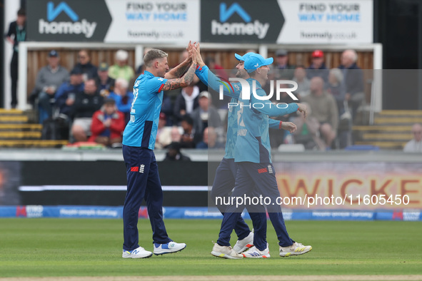 England's Brydon Carse celebrates with Will Jacks after having Australia's Mitchell Marsh caught behind the wicket in the Metro Bank One Day...