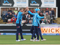 England's Brydon Carse celebrates with Will Jacks after having Australia's Mitchell Marsh caught behind the wicket in the Metro Bank One Day...