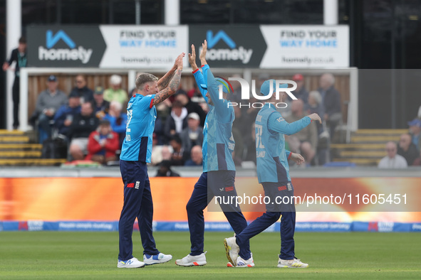 England's Brydon Carse celebrates with Will Jacks after having Australia's Mitchell Marsh caught behind the wicket in the Metro Bank One Day...