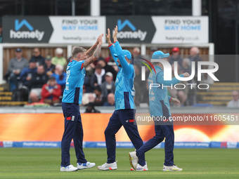 England's Brydon Carse celebrates with Will Jacks after having Australia's Mitchell Marsh caught behind the wicket in the Metro Bank One Day...