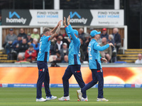 England's Brydon Carse celebrates with Will Jacks after having Australia's Mitchell Marsh caught behind the wicket in the Metro Bank One Day...