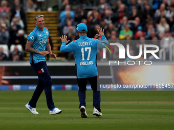 Brydon Carse of England celebrates taking the wicket of Mitchell Marsh during the Metro Bank One Day Series match between England and Austra...