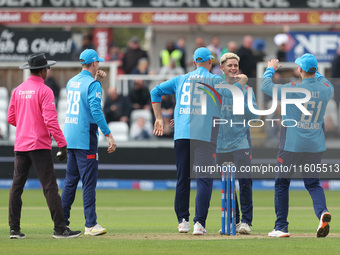 England's Jacob Bethell celebrates with his teammates after getting the wicket of Australia's Cameron Green during the Metro Bank One Day Se...