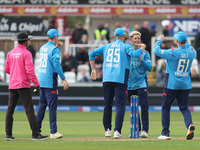 England's Jacob Bethell celebrates with his teammates after getting the wicket of Australia's Cameron Green during the Metro Bank One Day Se...