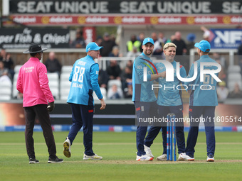 England's Jacob Bethell celebrates with his teammates after getting the wicket of Australia's Cameron Green during the Metro Bank One Day Se...