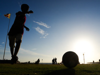 Kids play football at the Galle Face promenade in Colombo, Sri Lanka, on September 24, 2024. (