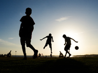 Kids play football at the Galle Face promenade in Colombo, Sri Lanka, on September 24, 2024. (