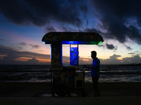 An ice cream vendor waits for customers in Colombo, Sri Lanka, on September 24, 2024. (