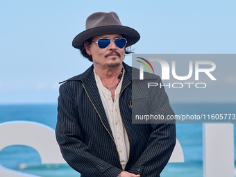 Johnny Depp attends the photocall of ''Modi, Three Days on the Wing of Madness'' during the 72nd San Sebastian International Film Festival i...