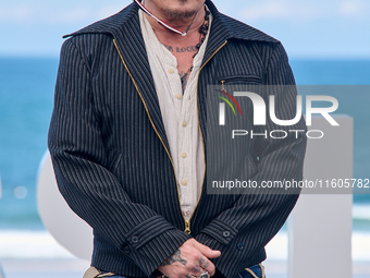 Johnny Depp attends the photocall of ''Modi, Three Days on the Wing of Madness'' during the 72nd San Sebastian International Film Festival i...