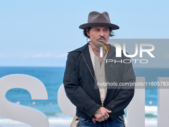 Johnny Depp attends the photocall of ''Modi, Three Days on the Wing of Madness'' during the 72nd San Sebastian International Film Festival i...