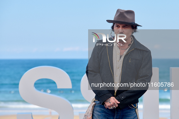 Johnny Depp attends the photocall of ''Modi, Three Days on the Wing of Madness'' during the 72nd San Sebastian International Film Festival i...