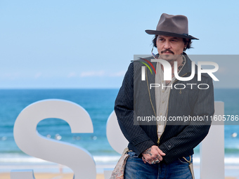 Johnny Depp attends the photocall of ''Modi, Three Days on the Wing of Madness'' during the 72nd San Sebastian International Film Festival i...