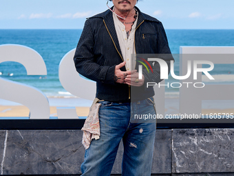 Johnny Depp attends the photocall of ''Modi, Three Days on the Wing of Madness'' during the 72nd San Sebastian International Film Festival i...