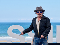 Johnny Depp attends the photocall of ''Modi, Three Days on the Wing of Madness'' during the 72nd San Sebastian International Film Festival i...