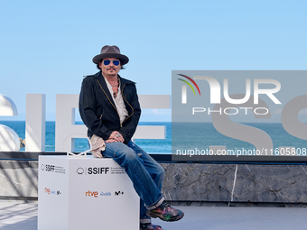 Johnny Depp attends the photocall of ''Modi, Three Days on the Wing of Madness'' during the 72nd San Sebastian International Film Festival i...