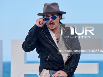 Johnny Depp attends the photocall of ''Modi, Three Days on the Wing of Madness'' during the 72nd San Sebastian International Film Festival i...