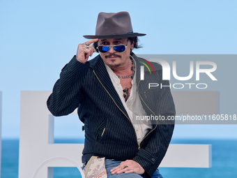 Johnny Depp attends the photocall of ''Modi, Three Days on the Wing of Madness'' during the 72nd San Sebastian International Film Festival i...