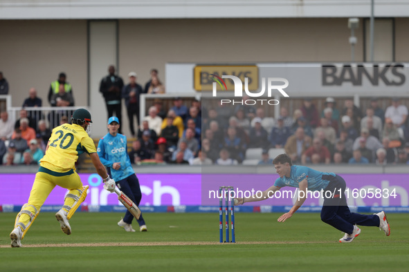 England's Matthew Potts runs out Australia's Aaron Hardie during the Metro Bank One Day Series match between England and Australia at the Se...