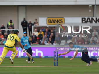 England's Matthew Potts runs out Australia's Aaron Hardie during the Metro Bank One Day Series match between England and Australia at the Se...