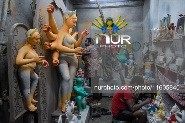 Artists make idols of Goddess Durga ahead of the Durga Puja festival in Kolkata, India, on September 24, 2024. 