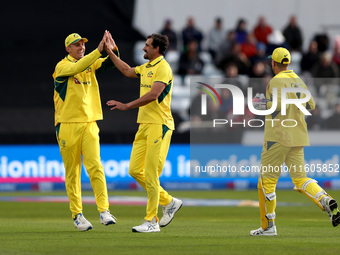 Mitchell Starc of Australia and teammates celebrate the wicket of Phil Salt of England during the Metro Bank One Day Series match between En...