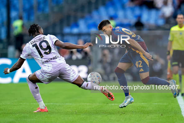 Kingsley Ehizibue of Udinese Calcio and Stephan El Shaarawy of AS Roma compete for the ball during the Serie A Enilive match between AS Roma...