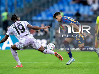 Kingsley Ehizibue of Udinese Calcio and Stephan El Shaarawy of AS Roma compete for the ball during the Serie A Enilive match between AS Roma...