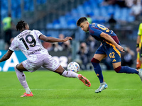 Kingsley Ehizibue of Udinese Calcio and Stephan El Shaarawy of AS Roma compete for the ball during the Serie A Enilive match between AS Roma...