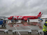 PLAY airline Airbus A321neo passenger aircraft spotted parked in front of the airport terminal building and the air bridge on the tarmac of...