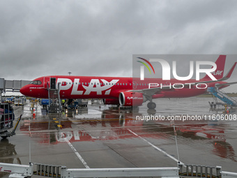 PLAY airline Airbus A321neo passenger aircraft spotted parked in front of the airport terminal building and the air bridge on the tarmac of...