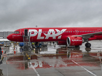 PLAY airline Airbus A321neo passenger aircraft spotted parked in front of the airport terminal building and the air bridge on the tarmac of...