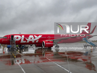 PLAY airline Airbus A321neo passenger aircraft spotted parked in front of the airport terminal building and the air bridge on the tarmac of...