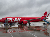 PLAY airline Airbus A321neo passenger aircraft spotted parked in front of the airport terminal building and the air bridge on the tarmac of...