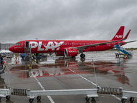 PLAY airline Airbus A321neo passenger aircraft spotted parked in front of the airport terminal building and the air bridge on the tarmac of...