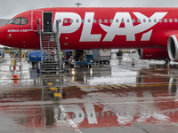 PLAY airline Airbus A321neo passenger aircraft spotted parked in front of the airport terminal building and the air bridge on the tarmac of...