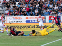 Gianluca Lapadula (#9 Cagliari Calcio) and Saro (US Cremonese) during the Italy Cup Frecciarossa match between Cagliari Calcio and US Cremon...