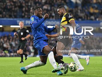 Emile Acquah (20 Barrow) is challenged by Axel Disasi (2 Chelsea) during the Carabao Cup Third Round match between Chelsea and Barrow at Sta...