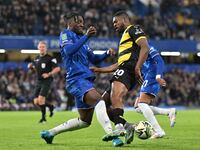 Emile Acquah (20 Barrow) is challenged by Axel Disasi (2 Chelsea) during the Carabao Cup Third Round match between Chelsea and Barrow at Sta...