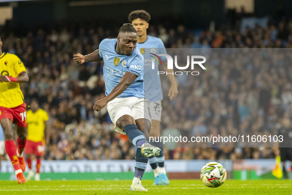 Jeremy Doku #11 of Manchester City F.C. scores a goal during the Carabao Cup Third Round match between Manchester City and Watford at the Et...